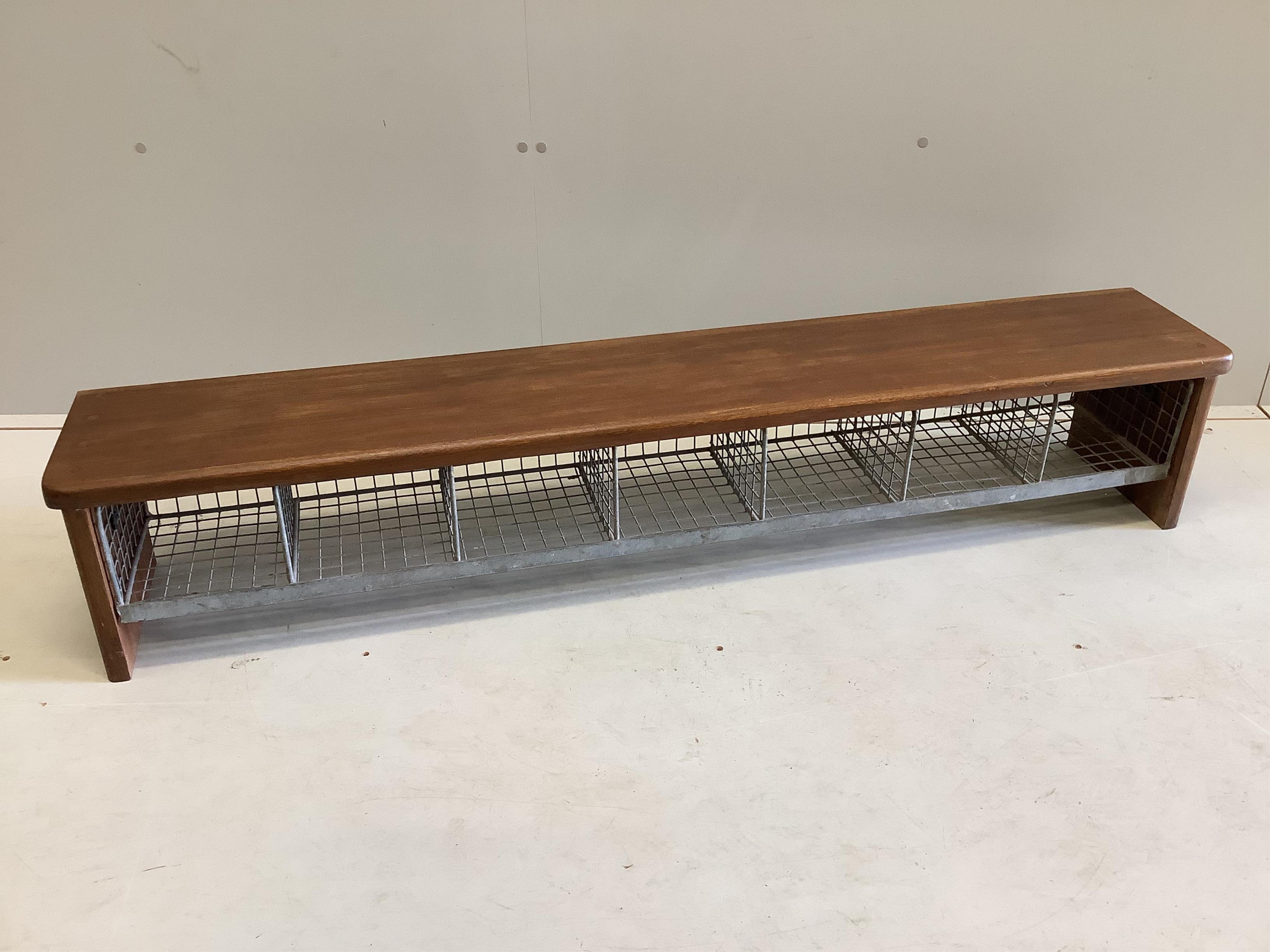 A mid century mahogany and wirework locker room shoe unit, width 147cm, depth 25cm, height 27cm